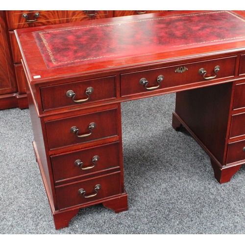 151 - A George III inspired library suite, comprising twin pedestal desk, bookcase, and corner display cab... 
