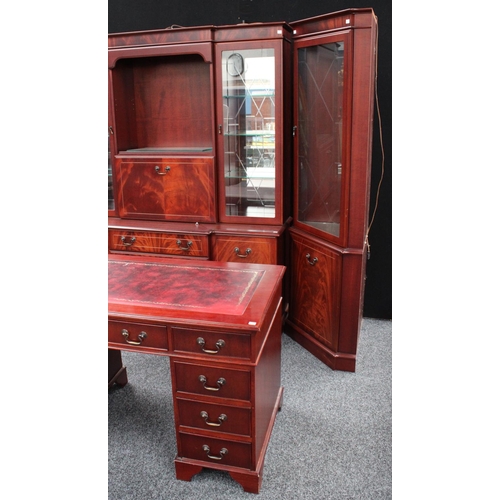 151 - A George III inspired library suite, comprising twin pedestal desk, bookcase, and corner display cab... 