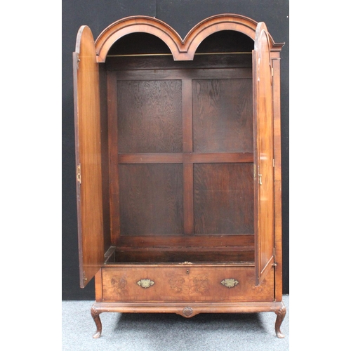 153 - A Queen Anne style walnut wardrobe, 'double-dome' cornice above a pair of doors enclosing a hanging ... 