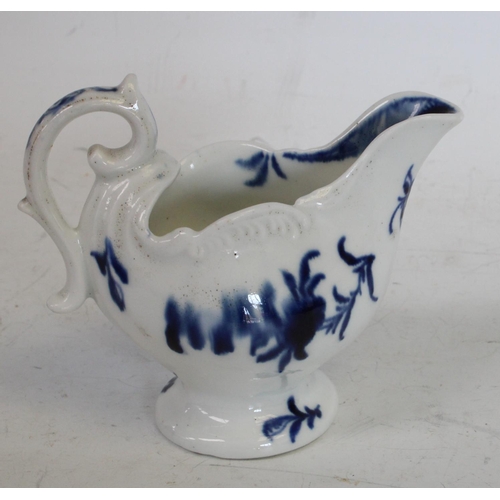 171 - A Derby low ewer, painted in underglaze blue with a two story hut on an island, moulded feathered ri... 