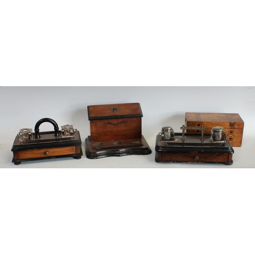 194 - A Victorian walnut and ebonised inkstand, c.1890; others: a Victorian walnut and parquetry tea caddy... 