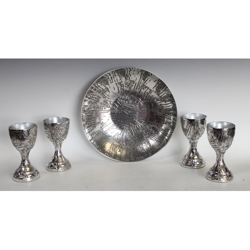 197 - A large bowl and four goblets by Stephen Daley made from Aluminium