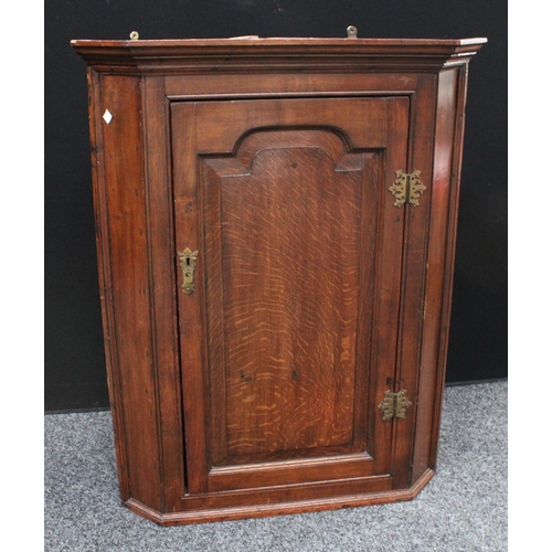 202 - A 19th century oak wall hanging corner cupboard