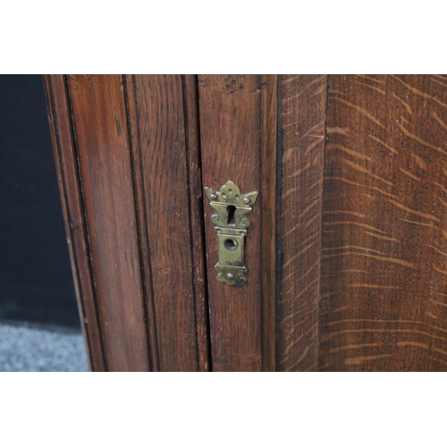 202 - A 19th century oak wall hanging corner cupboard