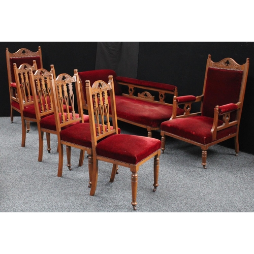 203 - An Arts and Crafts oak drawing room suite, comprising a chaise, four side chairs and a pair of armch... 