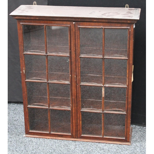 204 - A 19th century mahogany wall hanging display cabinet/china closet, moulded cornice above a pair of r... 