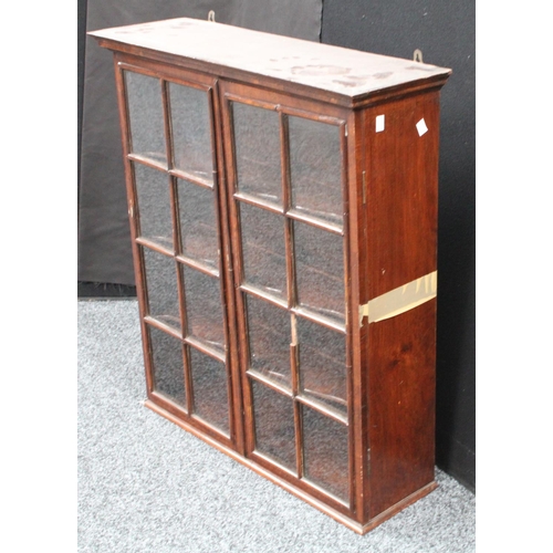204 - A 19th century mahogany wall hanging display cabinet/china closet, moulded cornice above a pair of r... 