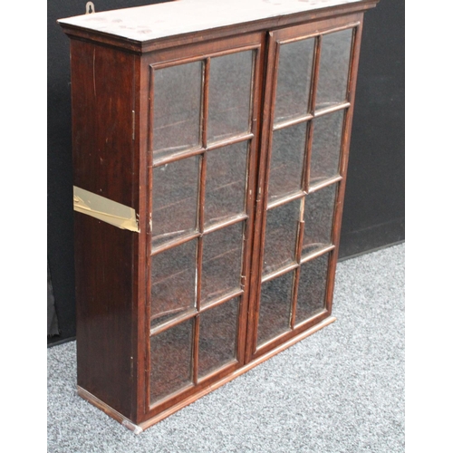 204 - A 19th century mahogany wall hanging display cabinet/china closet, moulded cornice above a pair of r... 