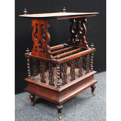 206 - A Victorian rosewood Canterbury whatnot, rectangular top with scrolling foliate end supports, the co... 