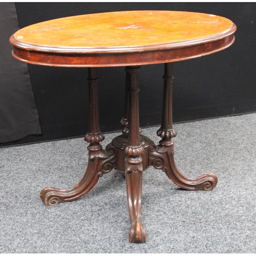 209 - A Victorian walnut centre table, elliptical top, cluster columnar support centred by a spire underfi... 
