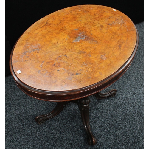 209 - A Victorian walnut centre table, elliptical top, cluster columnar support centred by a spire underfi... 