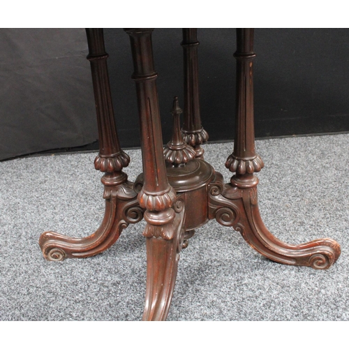 209 - A Victorian walnut centre table, elliptical top, cluster columnar support centred by a spire underfi... 