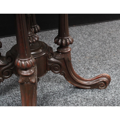 209 - A Victorian walnut centre table, elliptical top, cluster columnar support centred by a spire underfi... 