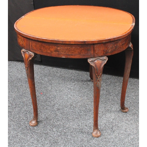 211 - A Queen Anne style walnut demilune card table, folding top enclosing a baize lined playing surface, ... 
