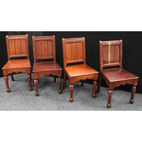213 - A set of four Gothic Revival pine hall/rectory chairs (4)
