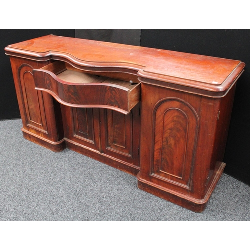 214 - A Victorian mahogany sideboard, inverted bowed break-centre above a frieze drawer and a pair of cupb... 