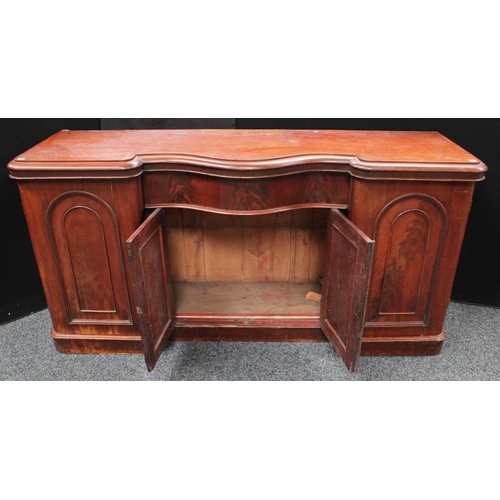 214 - A Victorian mahogany sideboard, inverted bowed break-centre above a frieze drawer and a pair of cupb... 