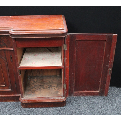 214 - A Victorian mahogany sideboard, inverted bowed break-centre above a frieze drawer and a pair of cupb... 