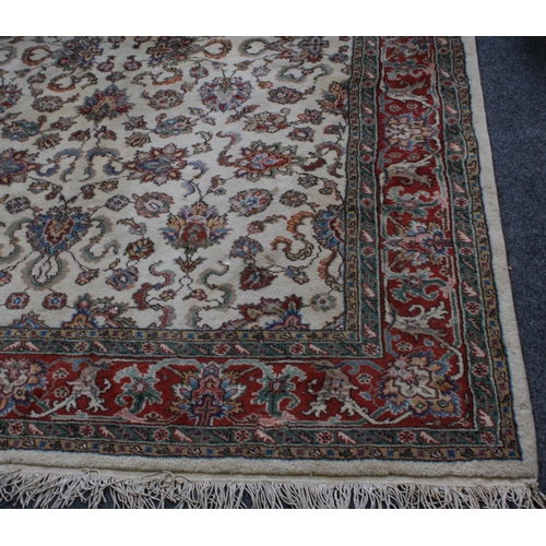 218 - An early 20th century rug,  decorated in bands of stylised flowers