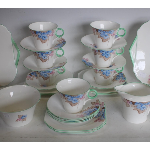231 - A Shelley floral pattern part tea service comprising 9 cups, 12 saucers, 10 side plates, 2 cake plat... 