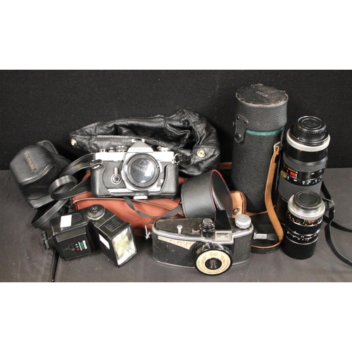 463 - Cameras - a vintager Olympus OM2 slr camera body, assorted lenses inc Hoya 75-260mm, Hanimex 105MM, ... 