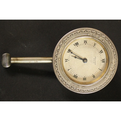 469 - Automobilia - an early 20th century dashboard clock, the silvered dial inscribed Waltham, USA
