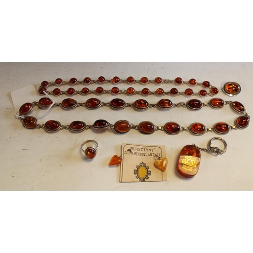 579 - An amber necklace, with twenty oval stones, 60cm long;  another, twenty-five stones, mounted on whit... 