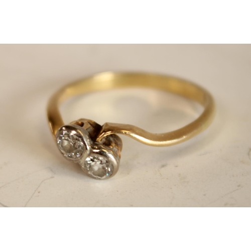 599 - A diamond crossover twist ring, inset with two old brilliant cut diamonds, each approx 0.15ct,total ... 