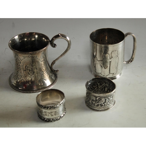 605 - A Victorian silver christening mug; an Edwardian silver napkin ring etc (4)