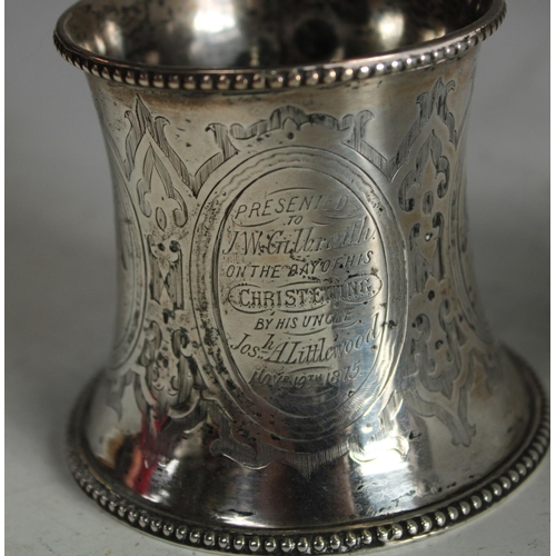 605 - A Victorian silver christening mug; an Edwardian silver napkin ring etc (4)