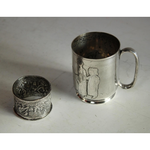 605 - A Victorian silver christening mug; an Edwardian silver napkin ring etc (4)