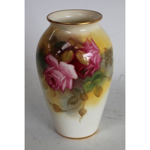 64 - A Royal Worcester ovoid vase, painted by Millie Hunt, signed, with roses, 9.75cm high, printed crown... 