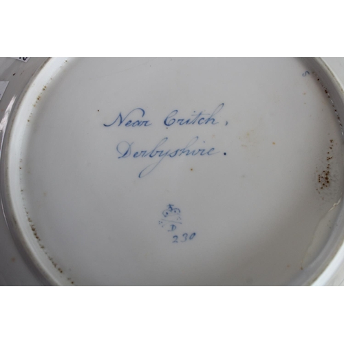 66 - An early 18th century Derby named view dish, Near Crich, Derbyshire; a shaped oval dish; another (3)