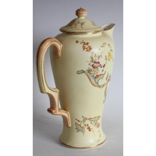 69 - A Royal Worcester coffee pot, yellow ground with floral decoration W4381 pattern