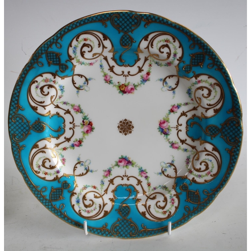 72 - A pair of Minton shaped circular cabinet plates, painted with swags of colourful flowers, turquoise ... 