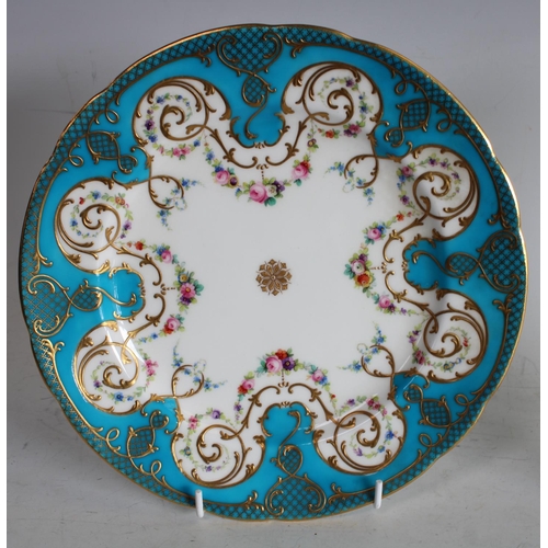 72 - A pair of Minton shaped circular cabinet plates, painted with swags of colourful flowers, turquoise ... 