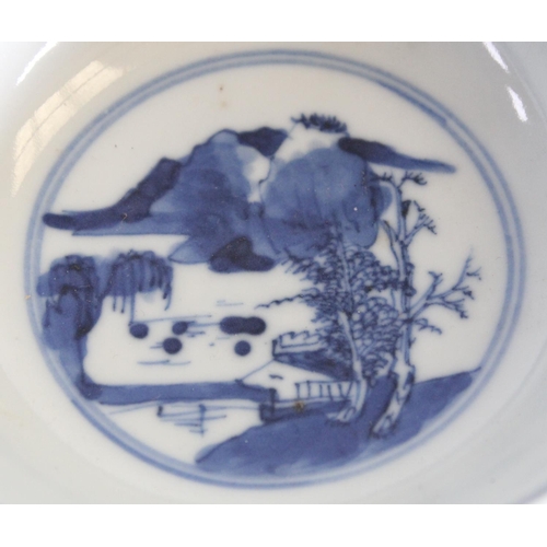 75 - A Chinese porcelain circular bowl, painted in underglaze blue with a stylized panoramic landscape, t... 