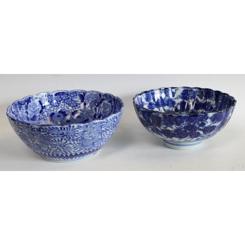 76 - An early 20th century Chinese blue and white bowl, shaped lip, 24cm diameter, another similar, large... 