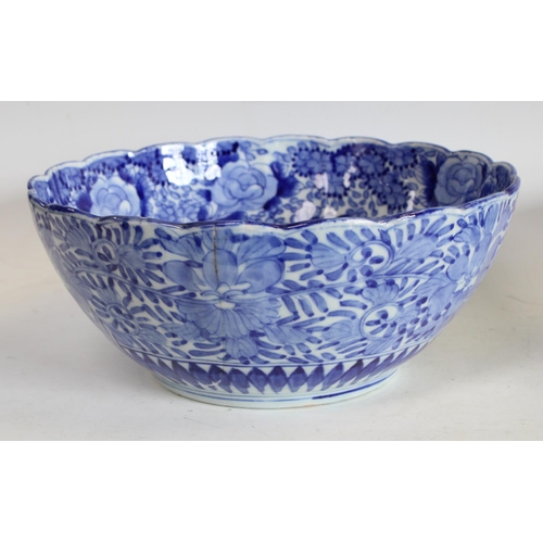 76 - An early 20th century Chinese blue and white bowl, shaped lip, 24cm diameter, another similar, large... 