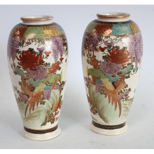 78 - A pair of  Japanese Satsuma ovoid vases, decorated overall with fanciful birds and wisteria, 15.5cm ... 