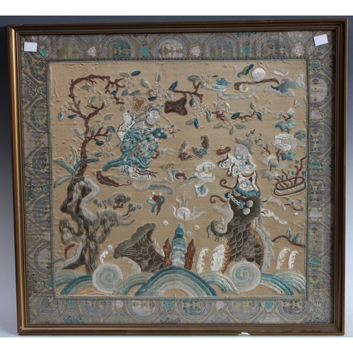 83 - An Oriental textile wall panel, woven throughout with figures in traditional dress, blossoming prunu... 