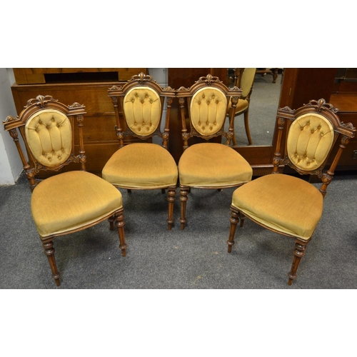 165 - Four Victorian salon chairs, foliate carved pediment, button upholstered back, padded seat, turned a... 