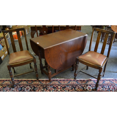 337 - A modern dropleaf table and two 1940's oak dining chairs. (3)