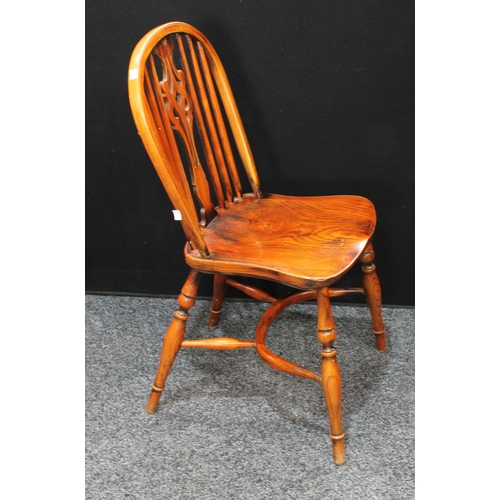 151 - A set of six oak and elm Windsor type dining side chairs, Crinoline stretchers (6)