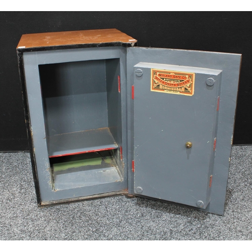 154 - A late 19th/early 20th century safe, labelled The Midland Safe Co, Manufacturers of Safes, Doors, Bo... 