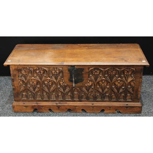 155 - A hardwood blanket chest, in the 15th century High Gothic taste, hinged top above a profuesly carved... 