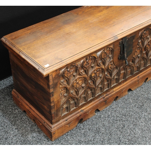 155 - A hardwood blanket chest, in the 15th century High Gothic taste, hinged top above a profuesly carved... 