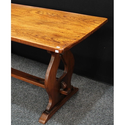 160 - A Gothic style oak refectory farmhouse trestle dining table, rectangular top, vasular end supports p... 