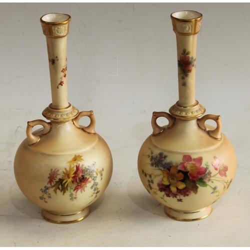 162 - A pair of Royal Worcester Blush Ivory two handled vases