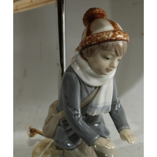 173 - An lamp as a kneeling boy, on alabaster base